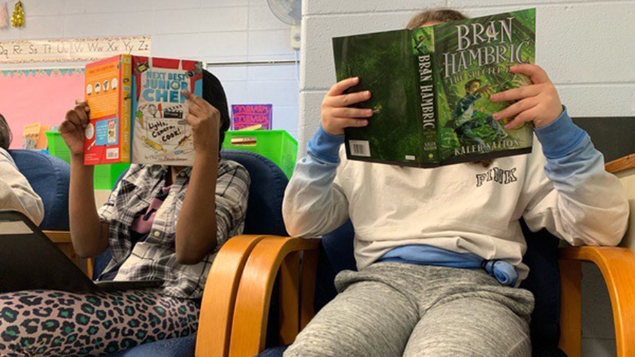 school students read books