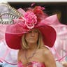 A race fan wears an elaborate pink hat with feathers and flowers for the Kentucky Derby at Churchill Downs in Louisville, Kentucky, on May 7, 2011.