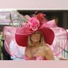 A race fan wears an elaborate pink hat with feathers and flowers for the Kentucky Derby at Churchill Downs in Louisville, Kentucky, on May 7, 2011.