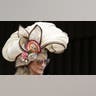 Cream-colored hat with floral embellishments