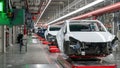 Cars are seen on the assembly line during a tour of the Tesla Giga Texas manufacturing facility ahead of the "Cyber Rodeo" grand opening party on April 7, 2022 in Austin, Texas. - Tesla welcomed throngs of  electric car lovers to Texas on April 7 for a huge party inaugurating a "gigafactory" the size of 100 professional soccer fields. (Photo by SUZANNE CORDEIRO / AFP) (Photo by SUZANNE CORDEIRO/AFP via Getty Images)
