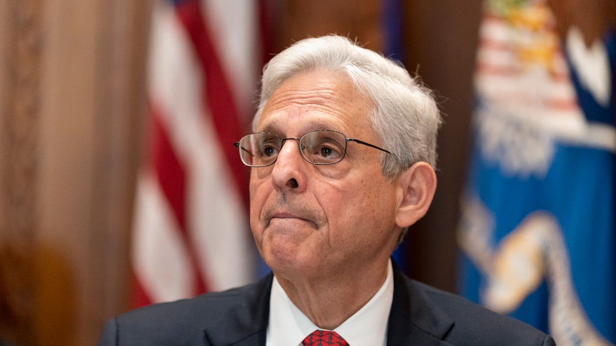 Merrick Garland listening during a media availability