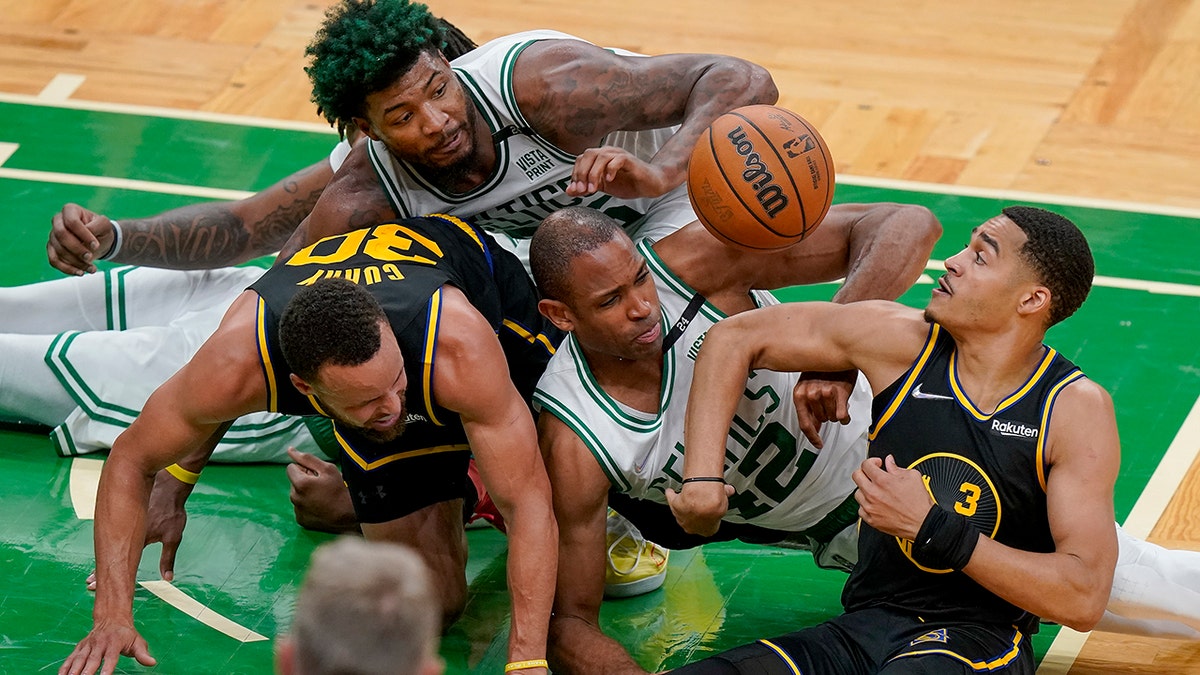 Al Horford dives for the ball