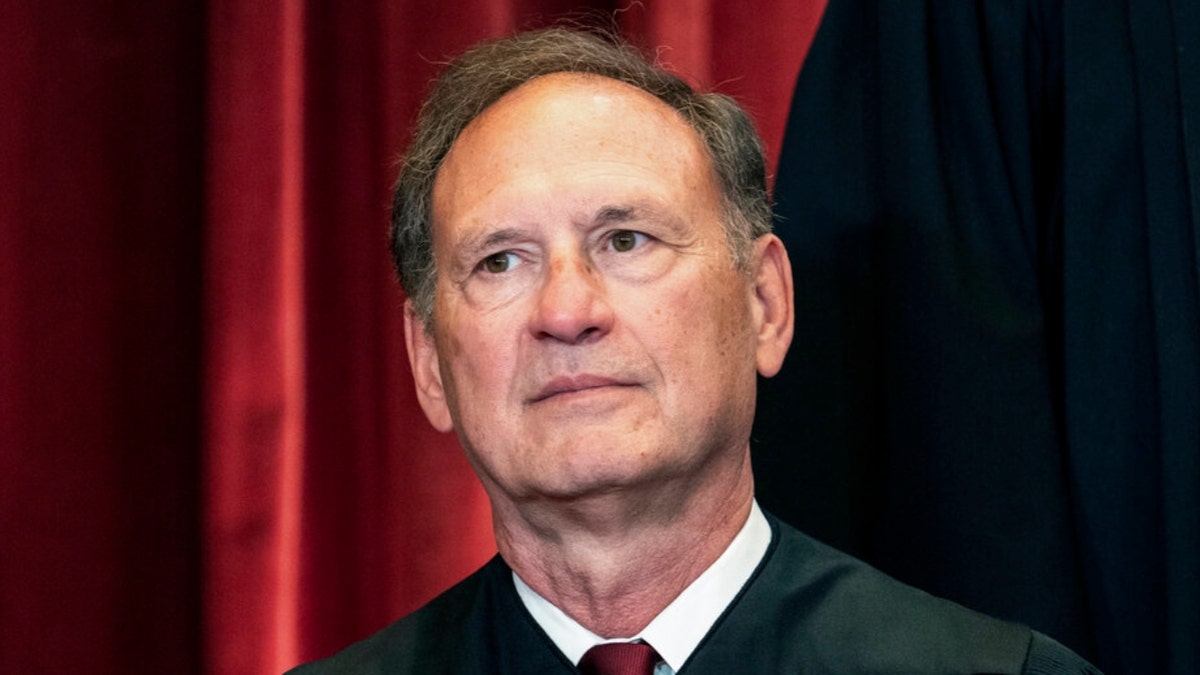 Justice Alito in judicial robes, seated