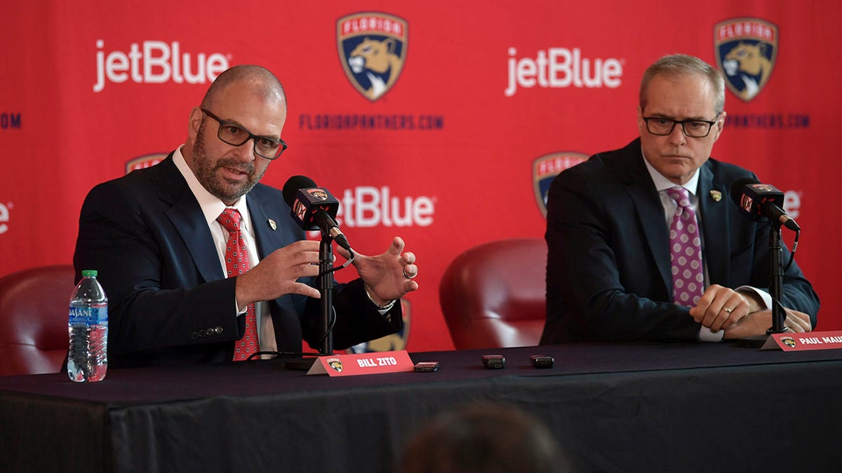 Bill Zito talking at press conference with Paul Maurice