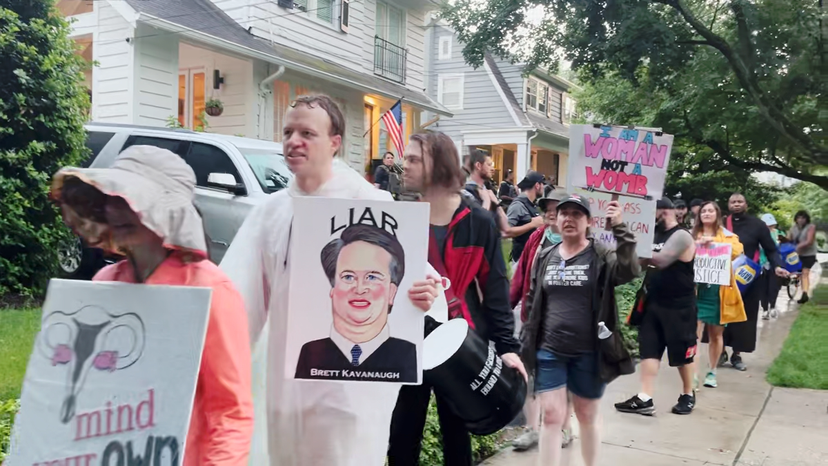 Protesters gather outside of the home of Justice Kavanaugh.