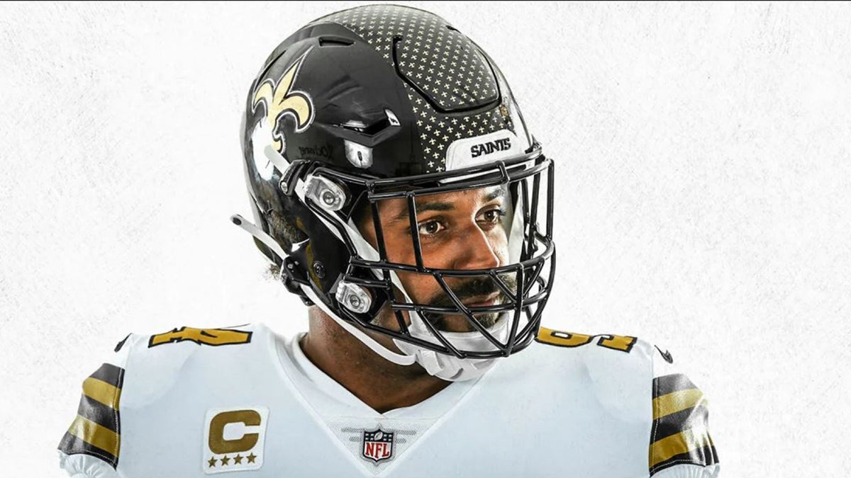 Cam Jordan wears the black Saints helmet