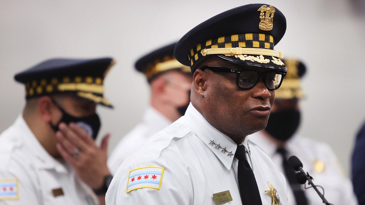 Chicago Police Superintendent David Brown delivers remarks in a white uniform with a black police hat