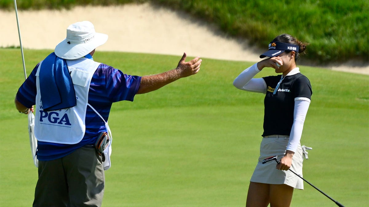 In Gee Chun and her caddy share a moment