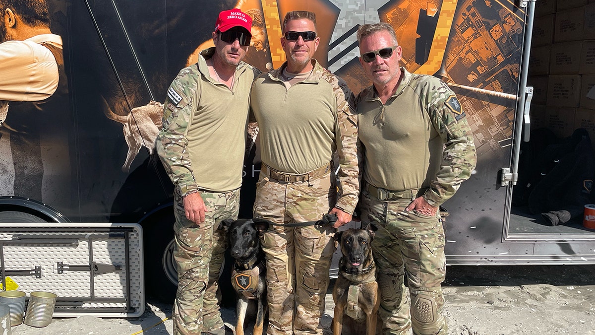 Shadow Warriors Project and Baden K9 leads pose with service dog donation recipient.