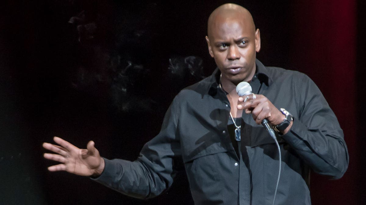 Dave Chappelle performs on stage