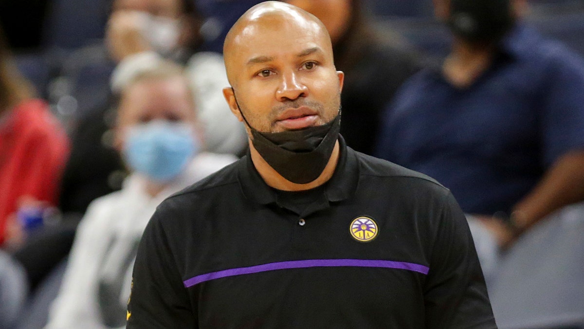 Derek Fisher watches team