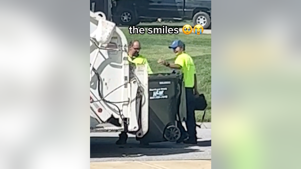 Two sanitation workers find cooler filled with snacks and drinks