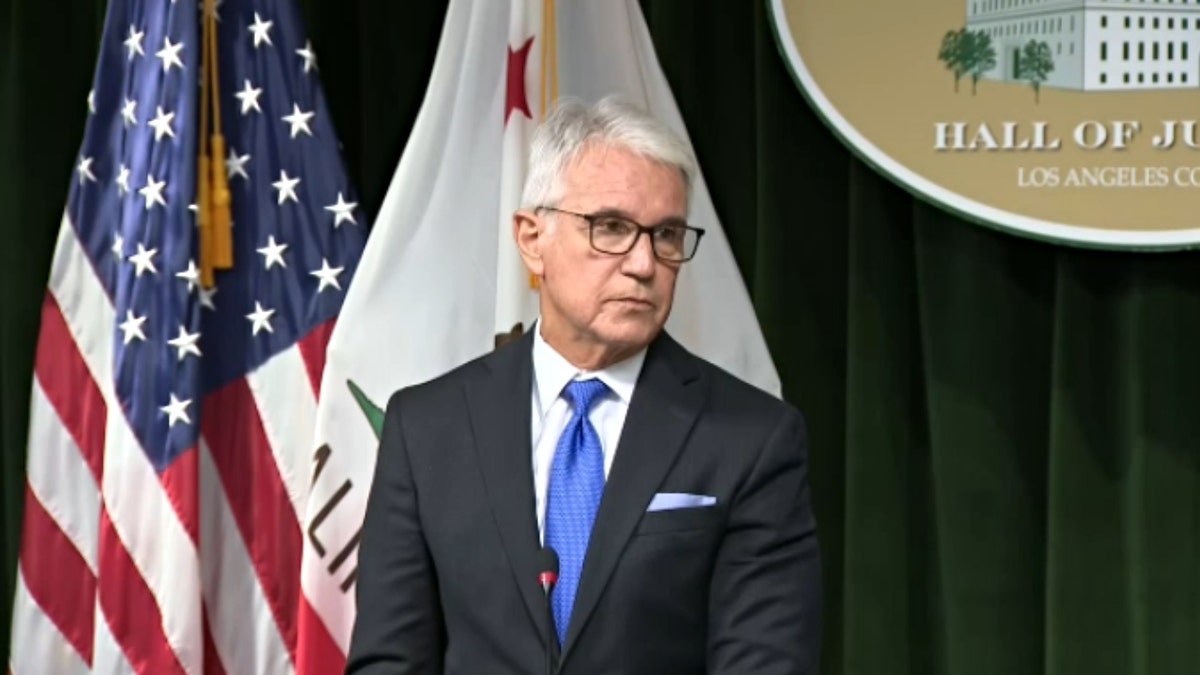 George Gascon frowns at podium