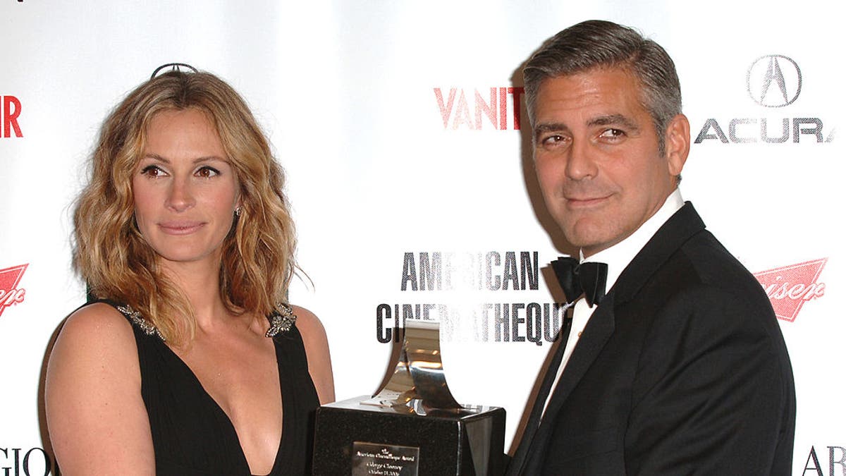 Julia Roberts and George Clooney at an awards show