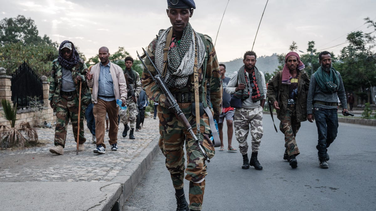 Ethiopia civil war, men march with guns