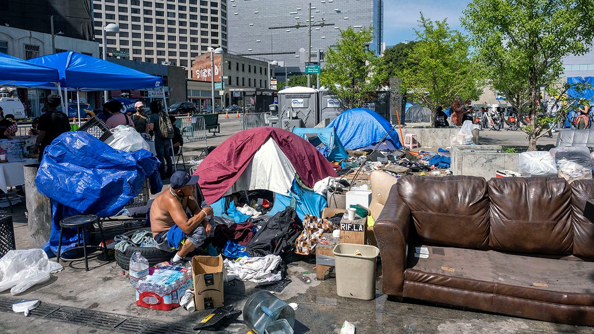 Debris, furniture and tents at Los Angeles homeless encampment