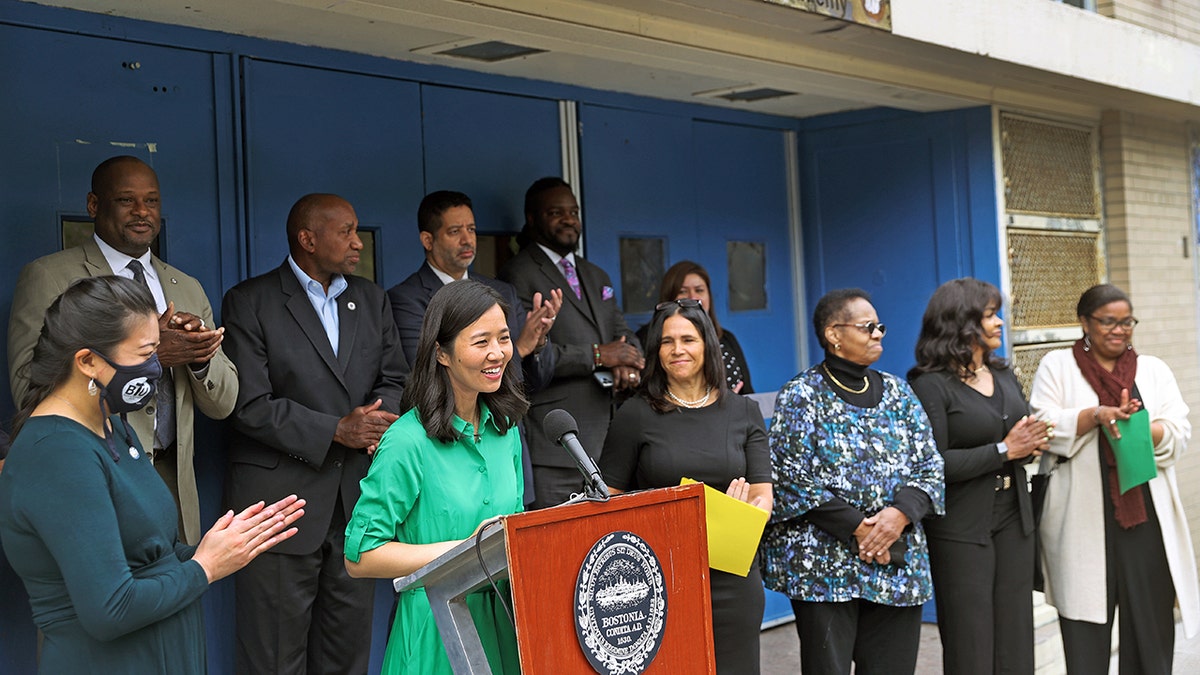 Boston Mayor Wu at podium by school officials