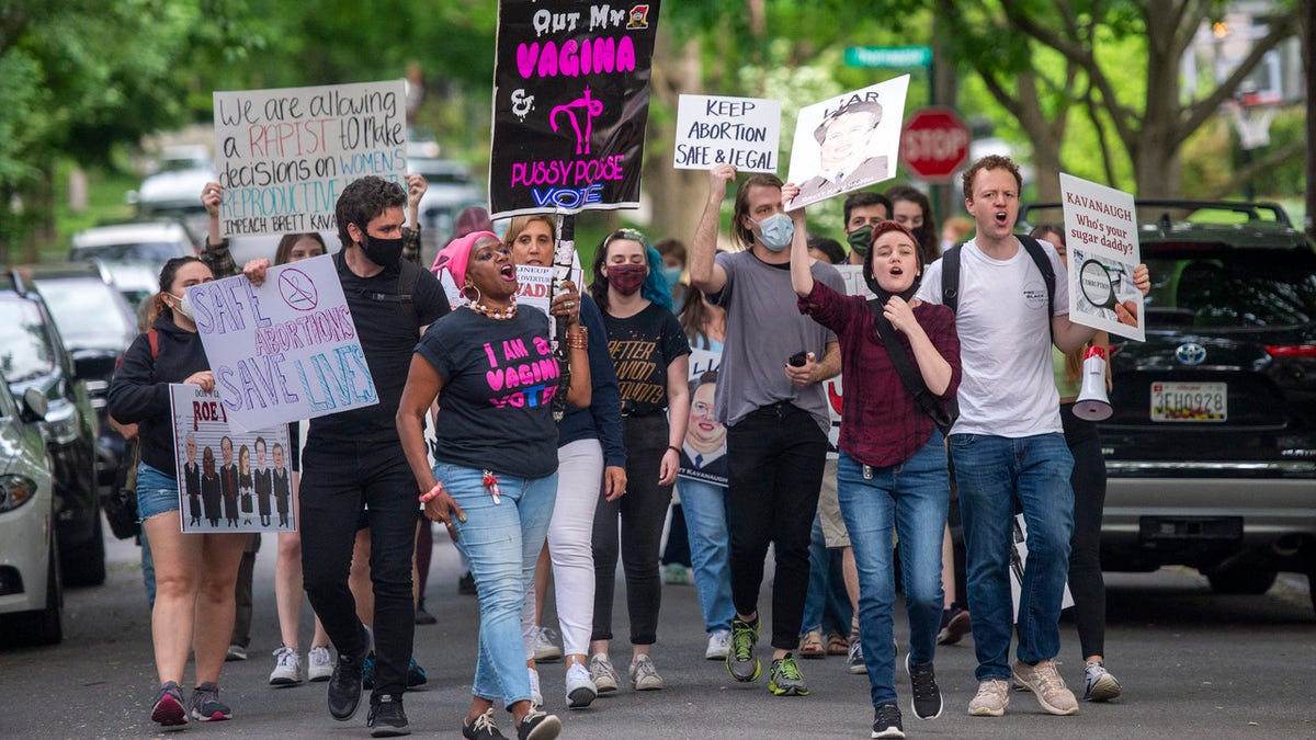 Pro-choice activists approach the home of U.S. Supreme Court Justice Brett Kavanaugh