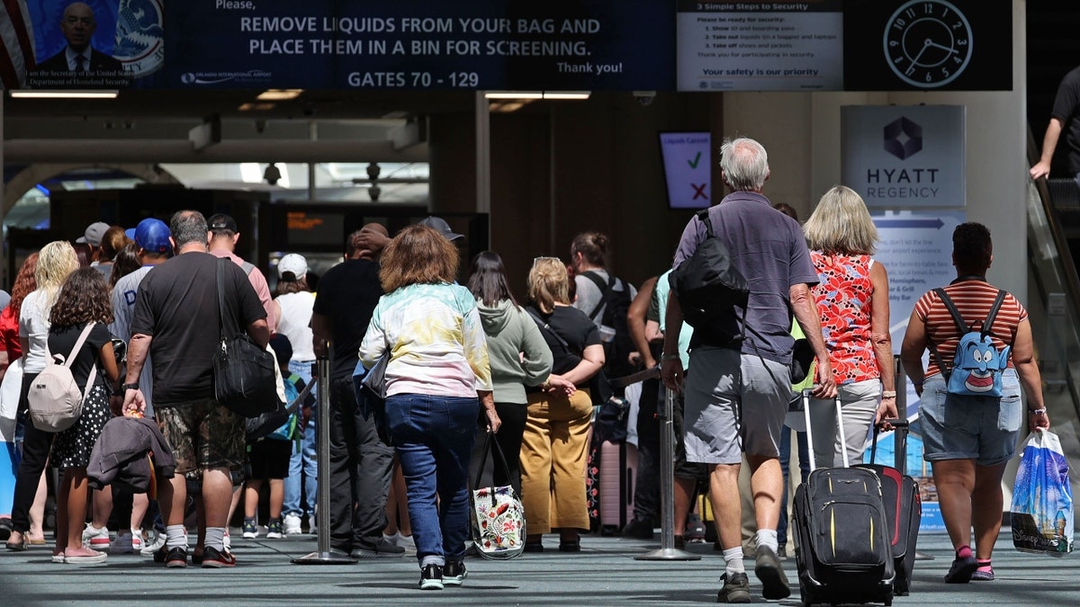 Passengers walking into Orlando International Airport