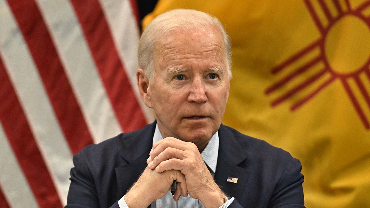 President Biden clasps hands at New Mexico wildfires talk