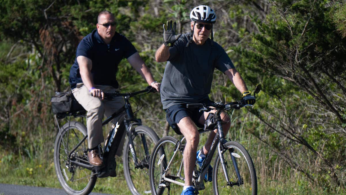 President Biden falls off bike