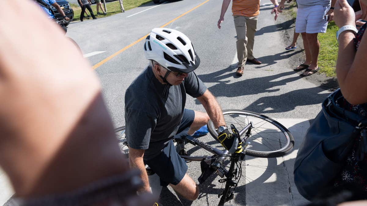 President Biden falls off bike