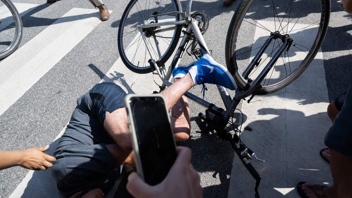 President Biden falls off bike