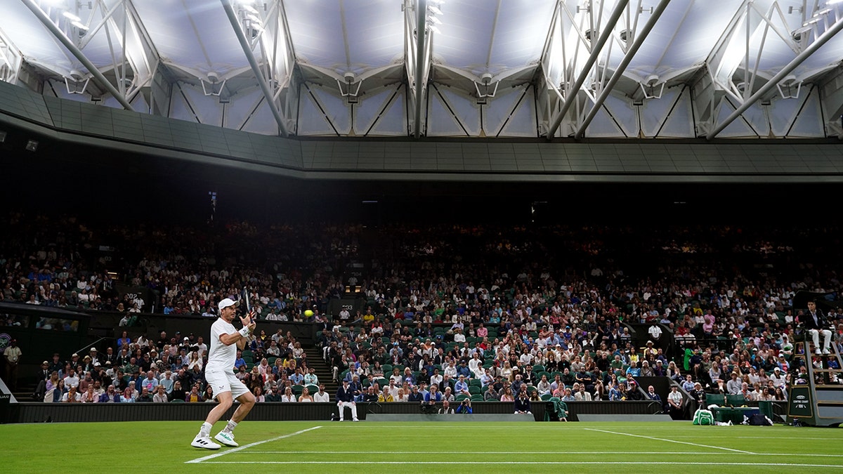 Andy Murray serves