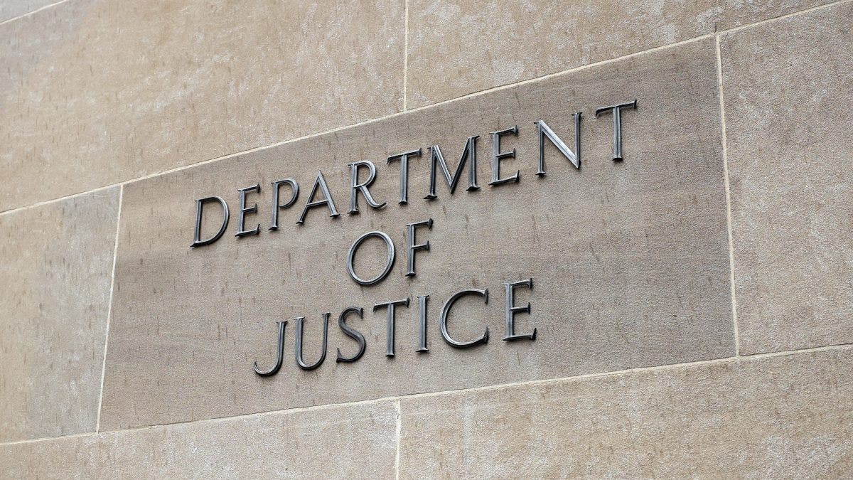 Justice Department sign on a building