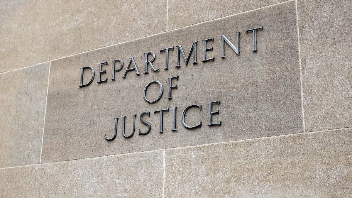 Justice of Department sign on a building