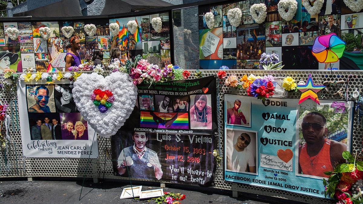 Flowers and photos left in memory of Pulse massacre victims