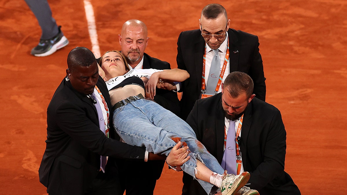 Protester French Open carried off