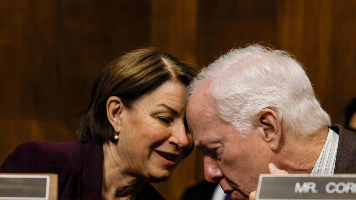 Sen. Amy Klobuchar (D-Minn.) speaks to Sen. John Cornyn (R-Texas)