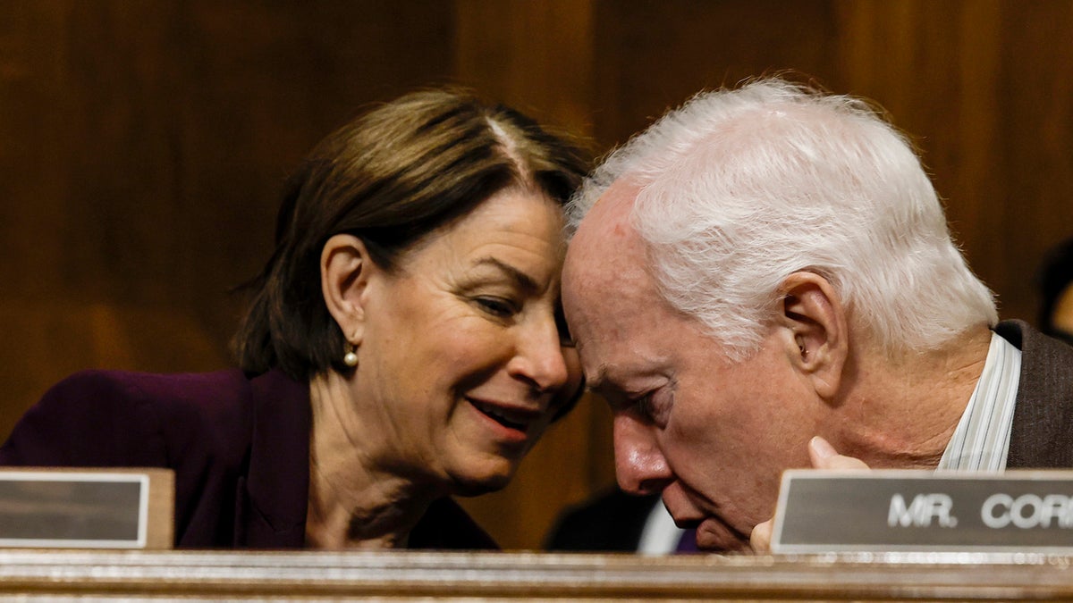 Sen. Amy Klobuchar (D-Minn.) speaks to Sen. John Cornyn (R-Texas)
