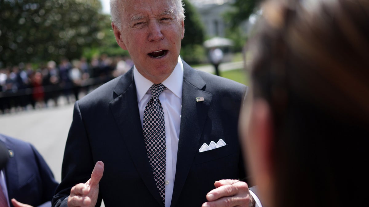 President Joe Biden speaks to members of the press