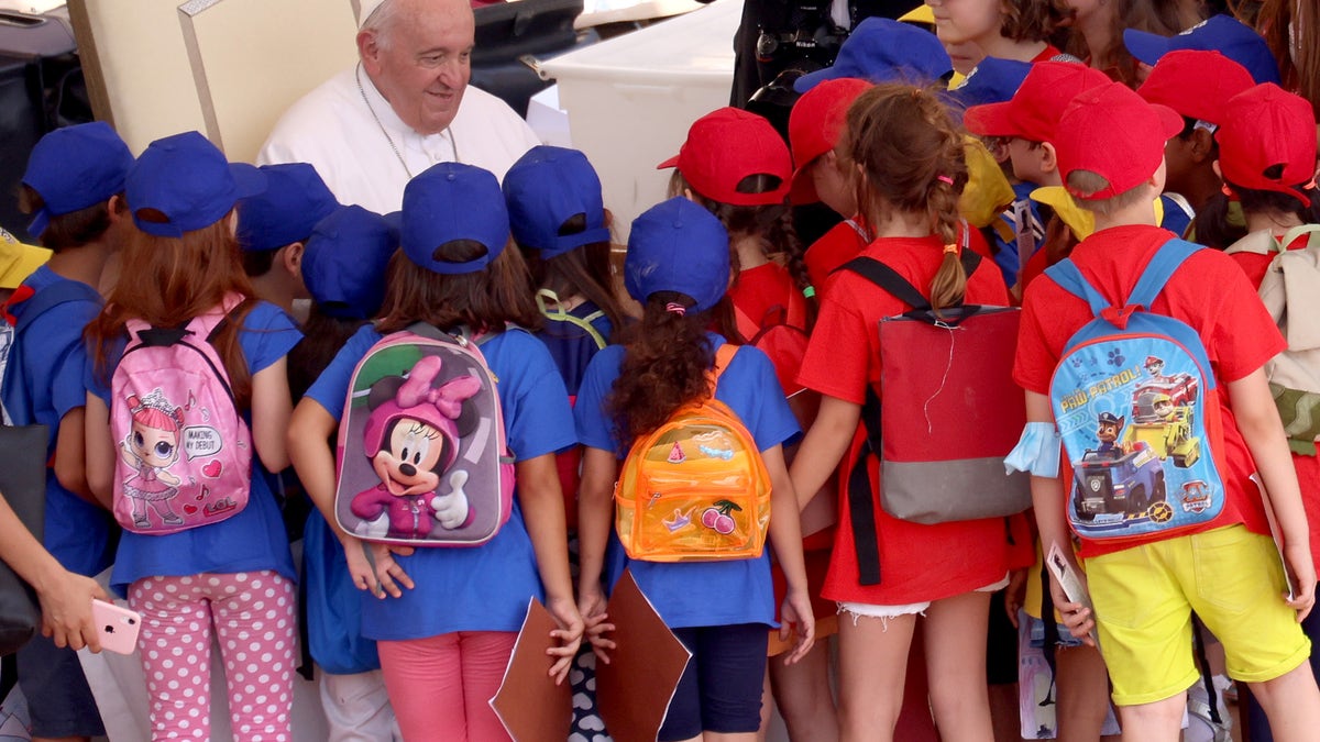 Pope Francis greets kids children in Vatican City