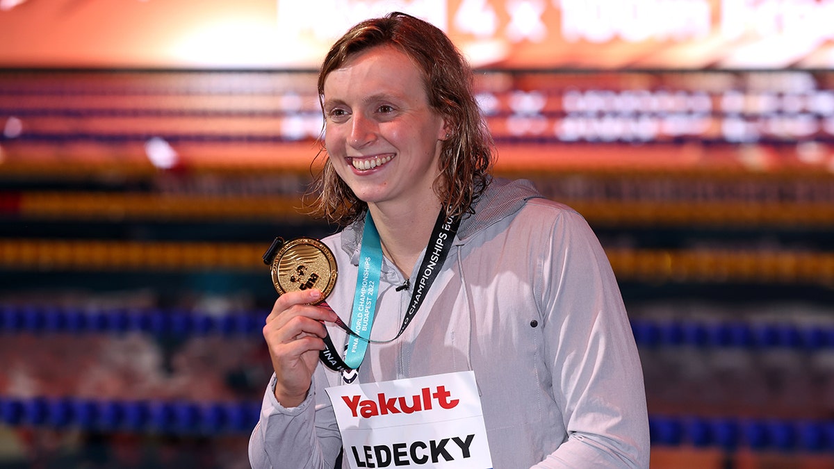 Katie Ledecky shows off gold at world championships