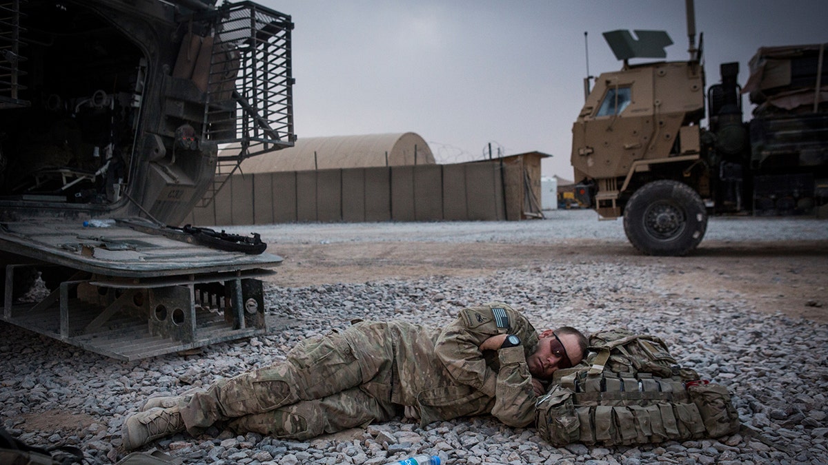 Army soldier sleeps in Afghanistan