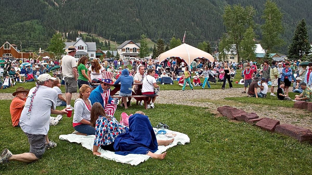 Family gather is open fields for 4th of July