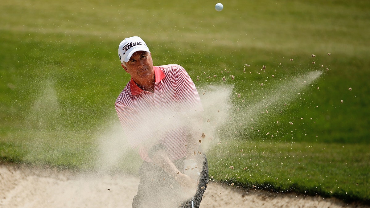 Curtis Strange hits a bunker shot