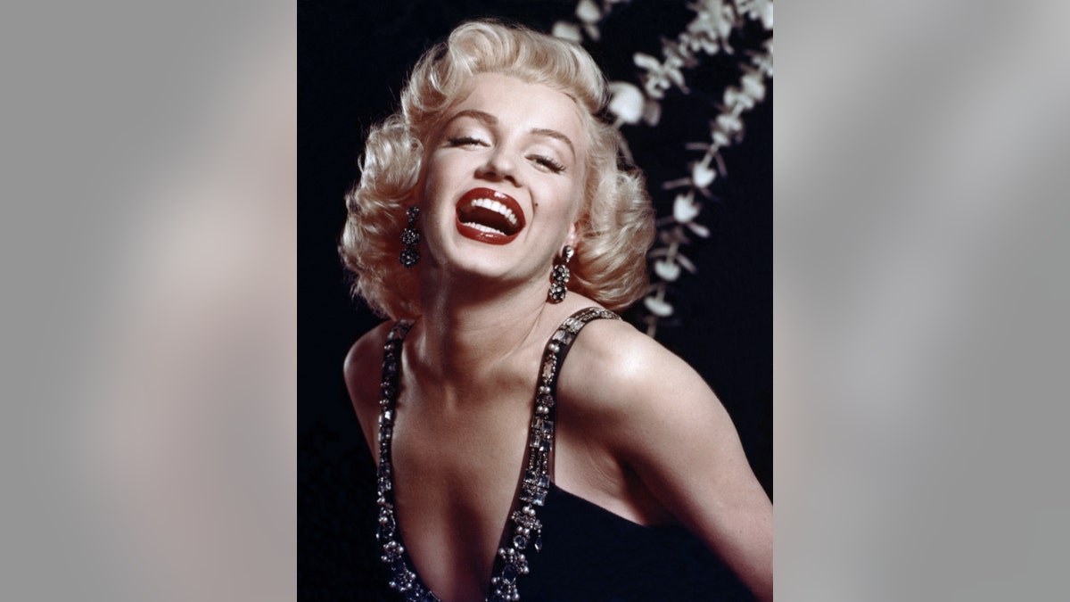 Marilyn Monroe having a movie break print by Celebrity Collection