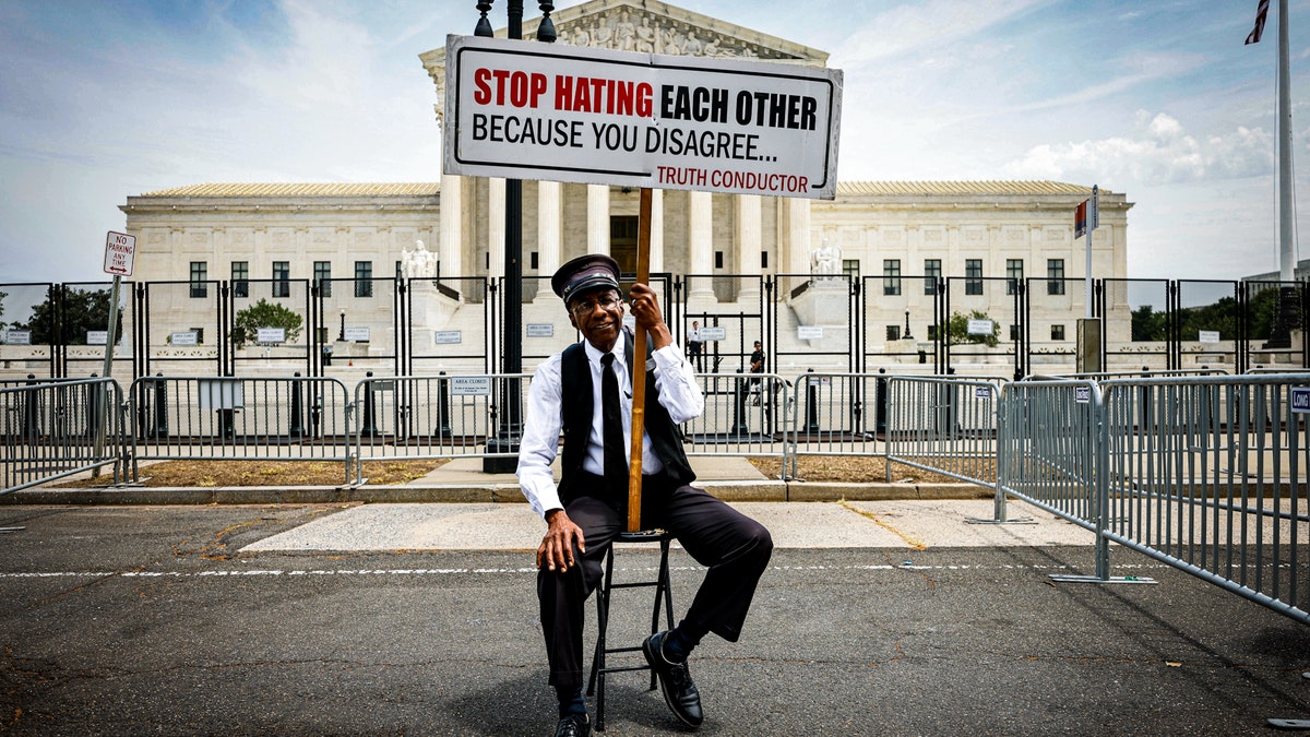 SCOTUS demonstrator calls for end to hate