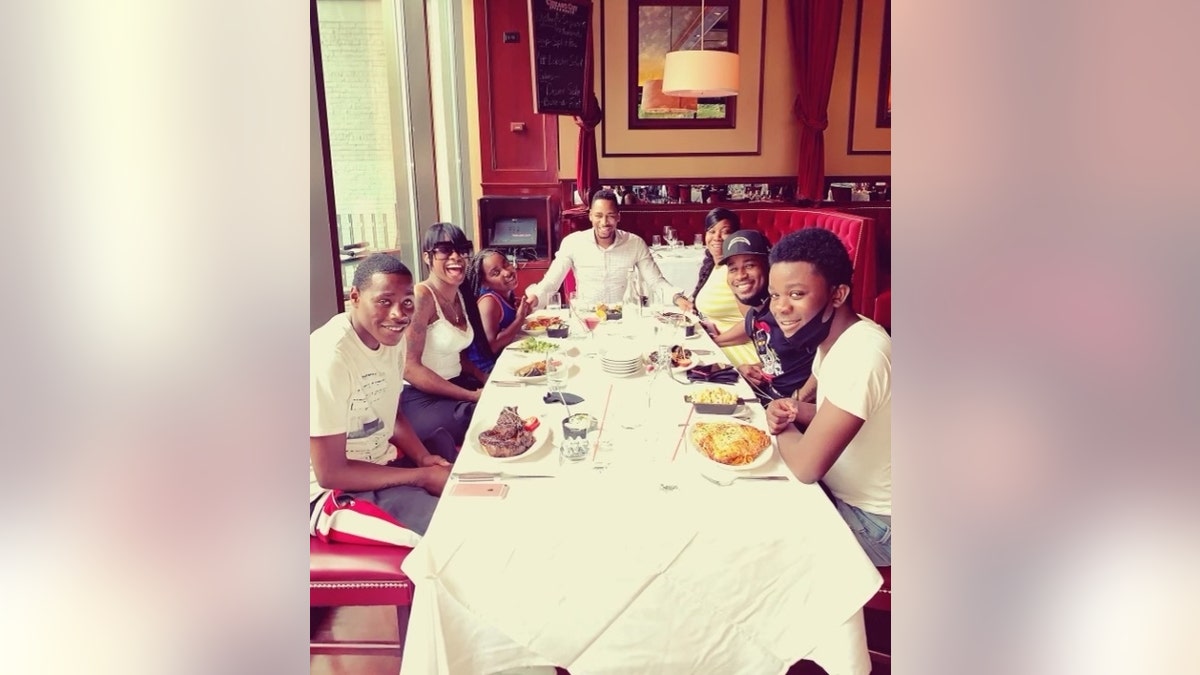 Gianno Caldwell and his siblings at a restaurant