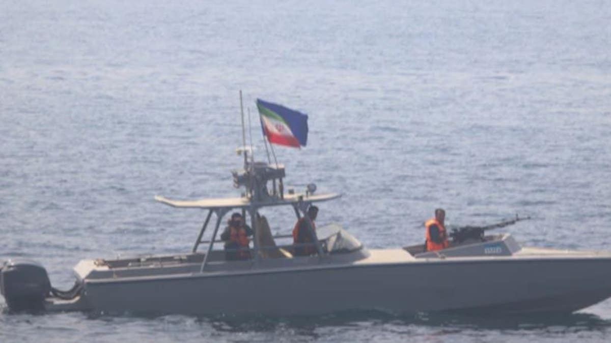 An Iranian naval vessel challenges the USS Sirocco.