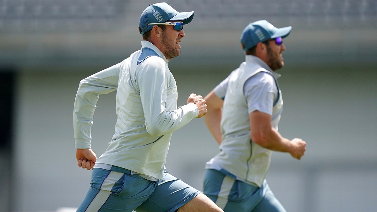 Craig Overton and Jamie Overton jog