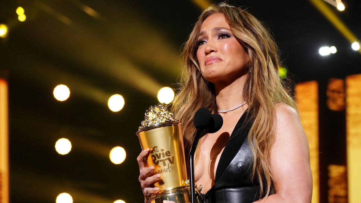 Jennifer Lopez accepts an award
