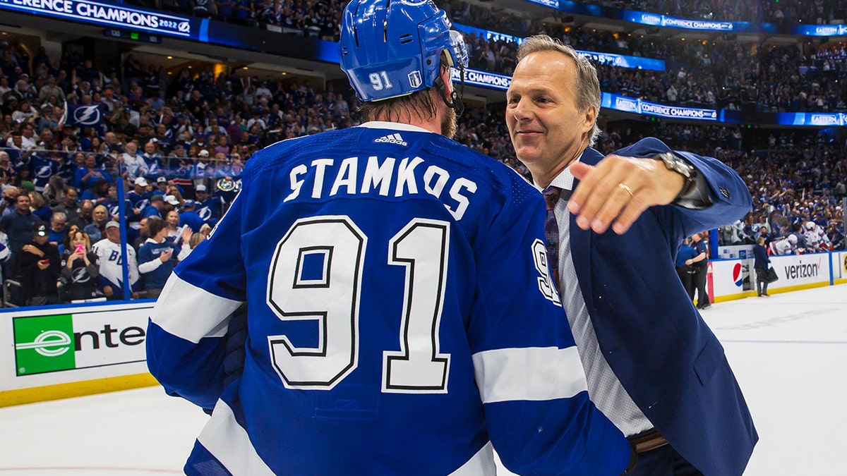 Jon Cooper hugs Steven Stamkos