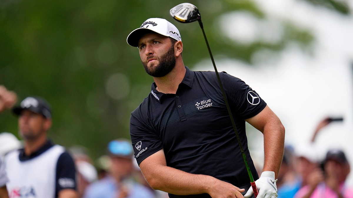 Jon Rahm swings on the 15th hole in Brookline