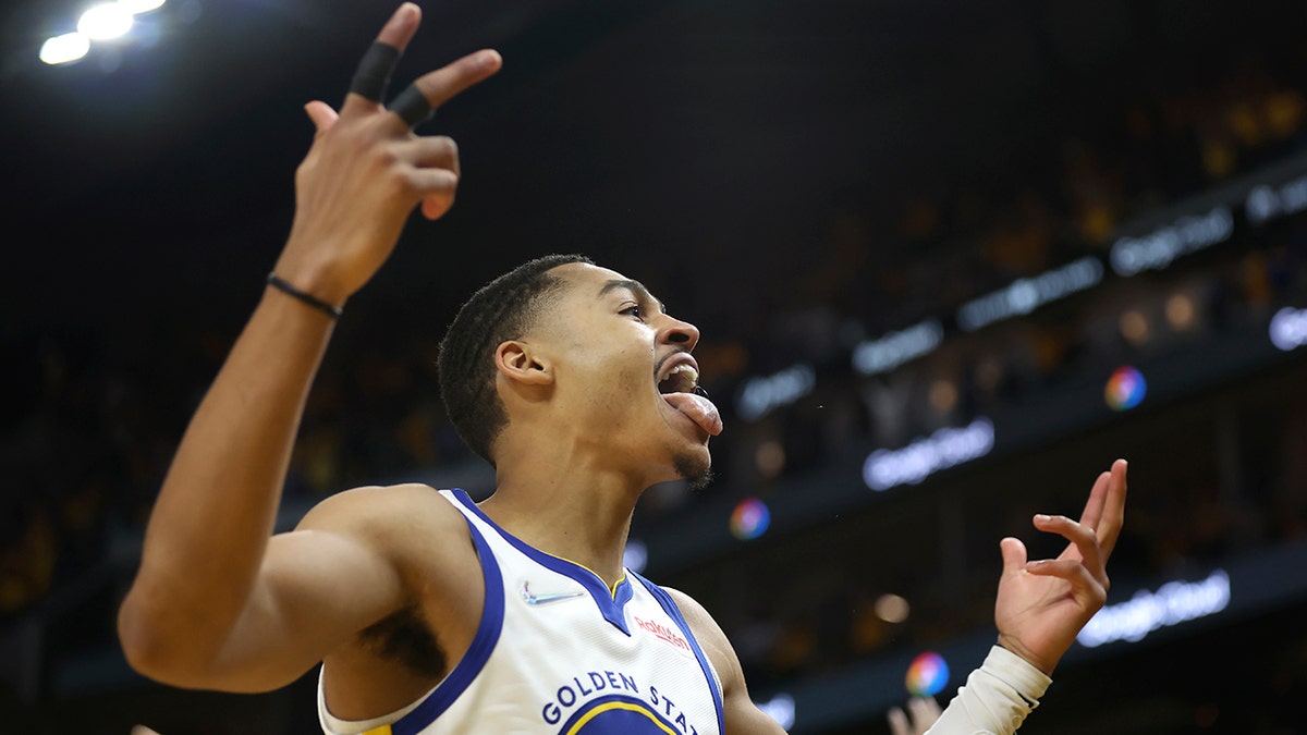 Jordan Poole celebrates shot